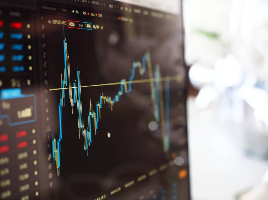 Time series graph on computer terminal displaying market fluctuations, key performance indicator (KPI) reporting, and data management for informed business decisions